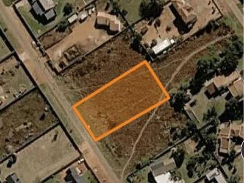 Aerial view of a vacant residential plot highlighted in an established neighborhood.