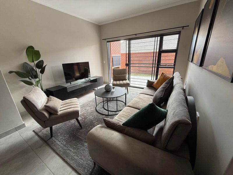 Sophisticated 3-Bedroom Simplex with Double Garage and Private Garden Sanctuary - Photo 9