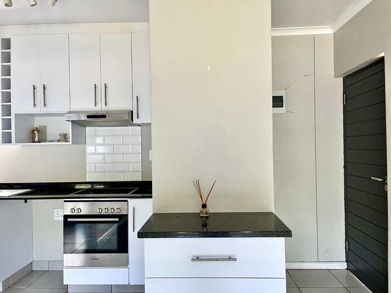 Stylish 1-Bed Garden Apartment in Sought-After The Woods Estate - Photo 3