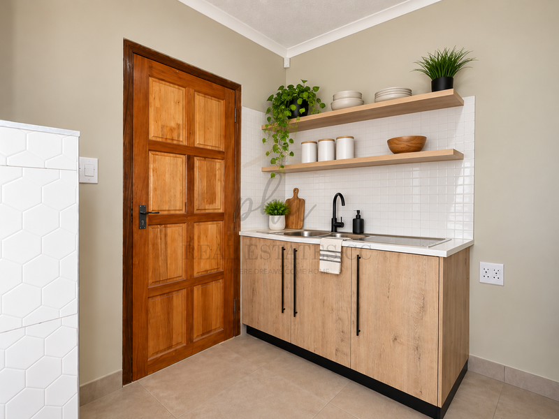 A modern scullery featuring light timber cabinetry, floating shelves, a stainless steel sink with a black mixer tap, and a classic timber door.
