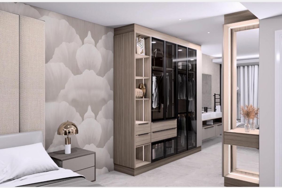 Modern bedroom featuring high-end built-in cabinetry with glass-fronted wardrobes, integrated shelving, and sophisticated recessed lighting.
