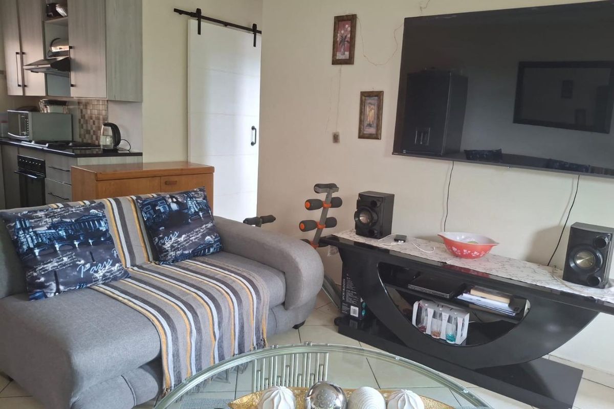 Secure solar powered two bedroom home featuring a built-in braai - Photo 4