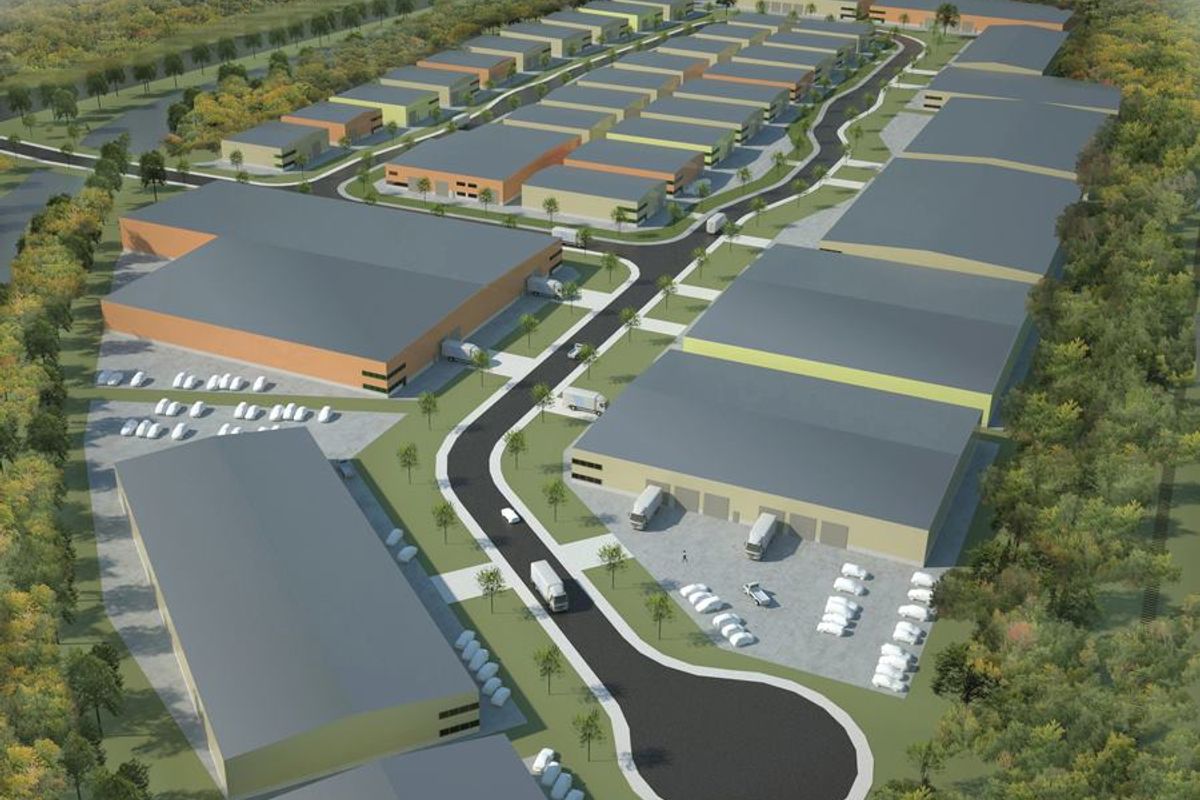 An aerial rendering of a commercial industrial park featuring multiple warehouse units, internal access roads, and dedicated parking facilities.