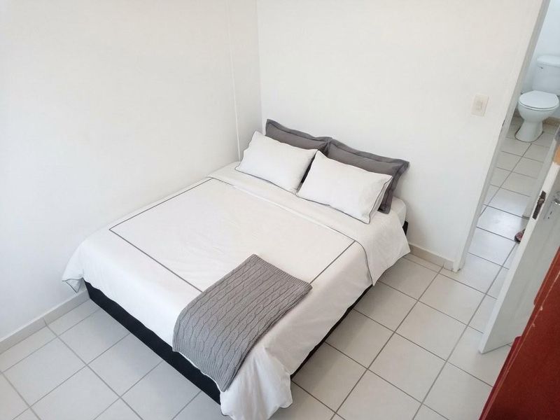 Exceptionally Secure Two-Bedroom Townhouse with Private Garden Retreat - Photo 9