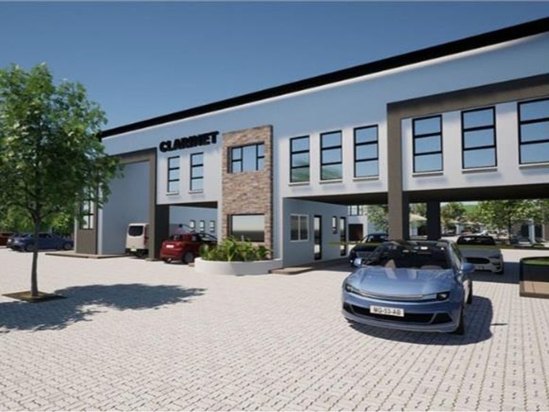 Modern multi-story residential complex exterior featuring contemporary architectural design, paved driveway, and integrated parking areas.