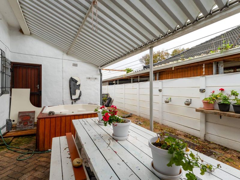 Delightfully spacious and loved family home adorned by lovely secure and established sunny garden plus built-in Braai area - this is a must see! - Photo 10