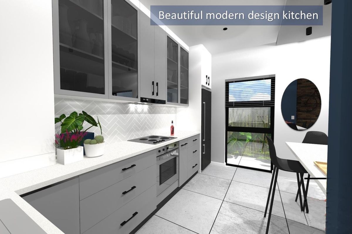 A modern kitchen featuring sleek grey cabinetry, integrated oven and hob, herringbone tile backsplash, and large format floor tiles with natural light.