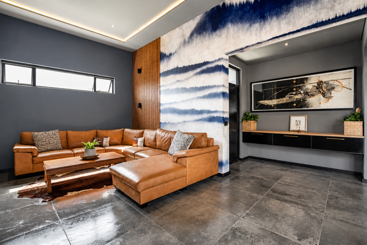 Modern living room featuring high ceilings with recessed lighting, timber slat wall accents, floating cabinetry, and large format floor tiles.
