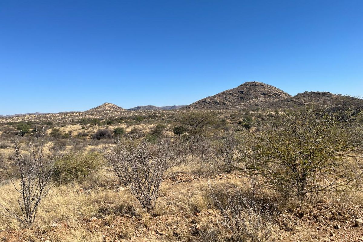 A scenic view of the natural landscape featuring rolling hills and native vegetation on this vacant residential land.