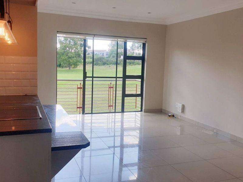 Swing Into Style: Sunlit 1st Floor Haven with Designer Kitchen in Golf Estate - Photo 3