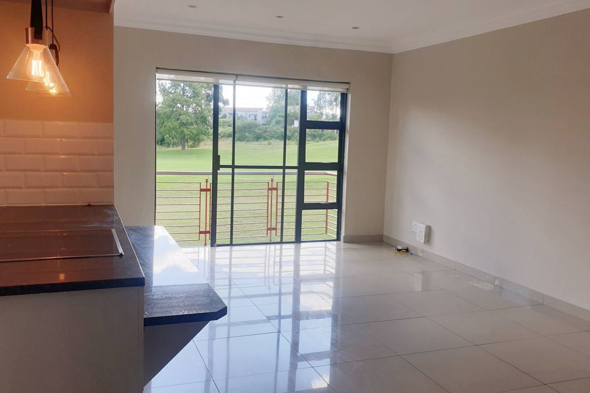 Swing Into Style: Sunlit 1st Floor Haven with Designer Kitchen in Golf Estate - Photo 3