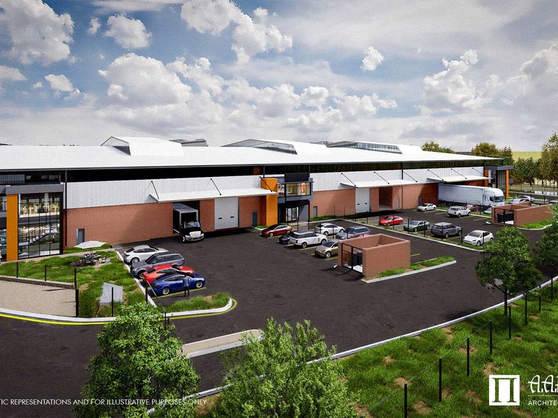 An aerial perspective of a modern industrial warehouse facility featuring multiple loading bays, paved parking areas, and professional landscaping.