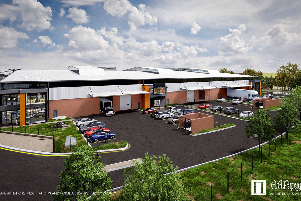 An aerial perspective of a modern industrial warehouse facility featuring multiple loading bays, paved parking areas, and professional landscaping.