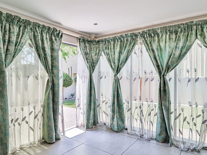 . "Unwind in Style: Elegant Home with Private Garden Bliss! - Photo 9