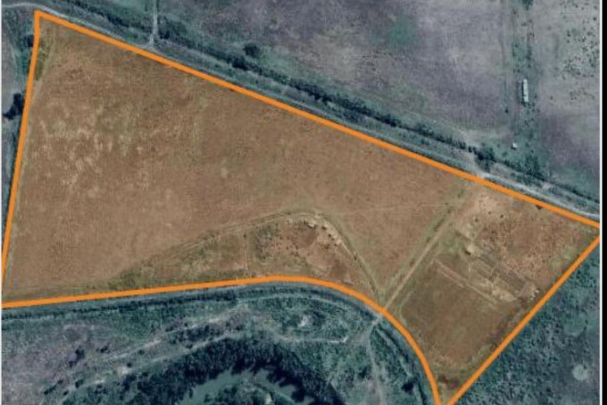 Aerial view of the farm property showing the land boundaries and surrounding landscape.