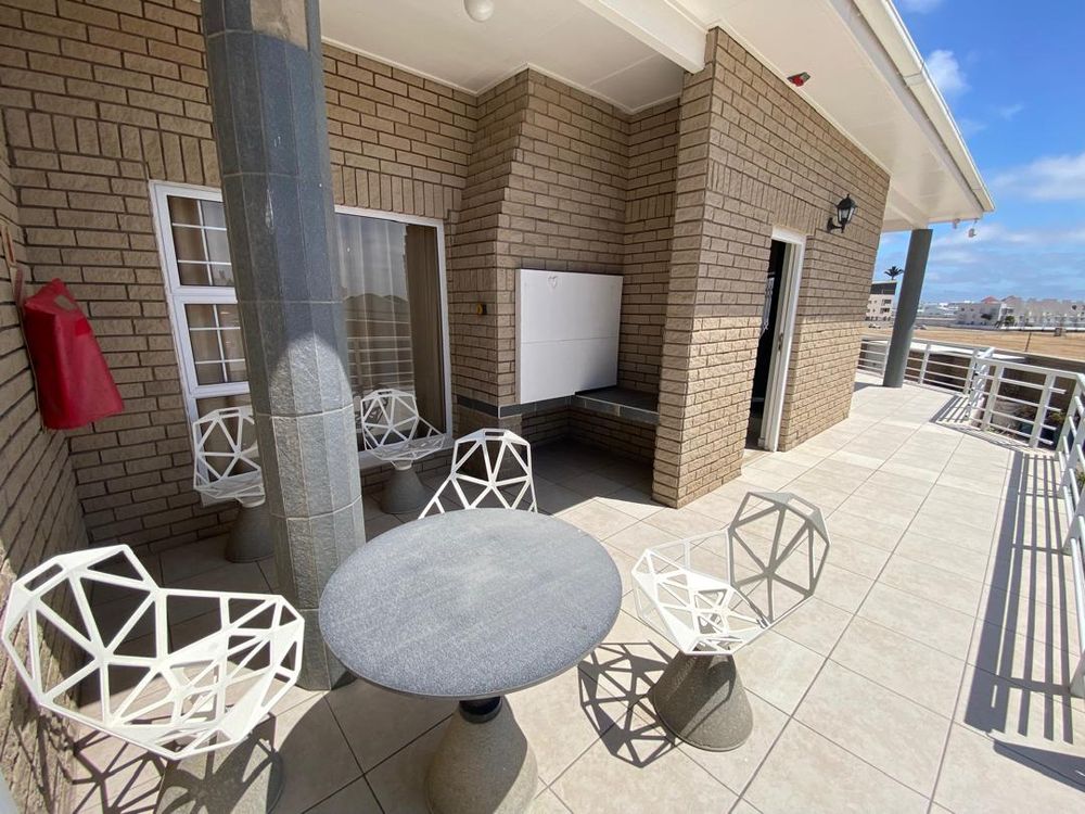 Sea view from the stoep. Front yard and outside BBQ area