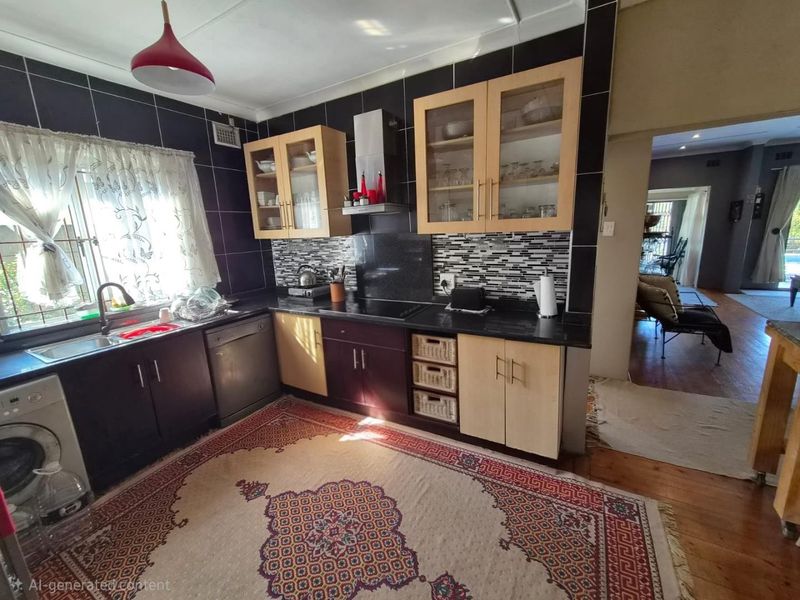 A functional kitchen featuring dark and light wood cabinetry, granite countertops, a tiled backsplash, and integrated appliances, with a view into the adjacent living area.