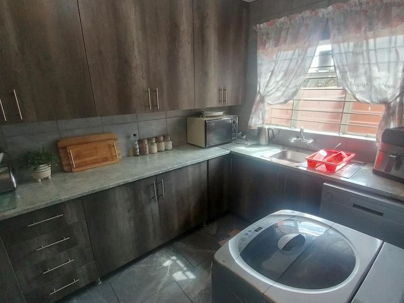 Modern Living Awaits: 2-Bedroom, Balcony, and a Lush Garden! - Photo 3