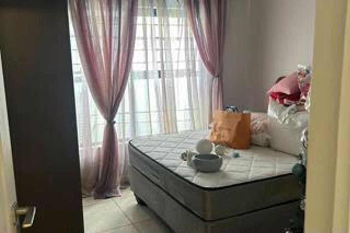 A bedroom featuring tiled flooring and a large window with curtains, providing natural light to the space.