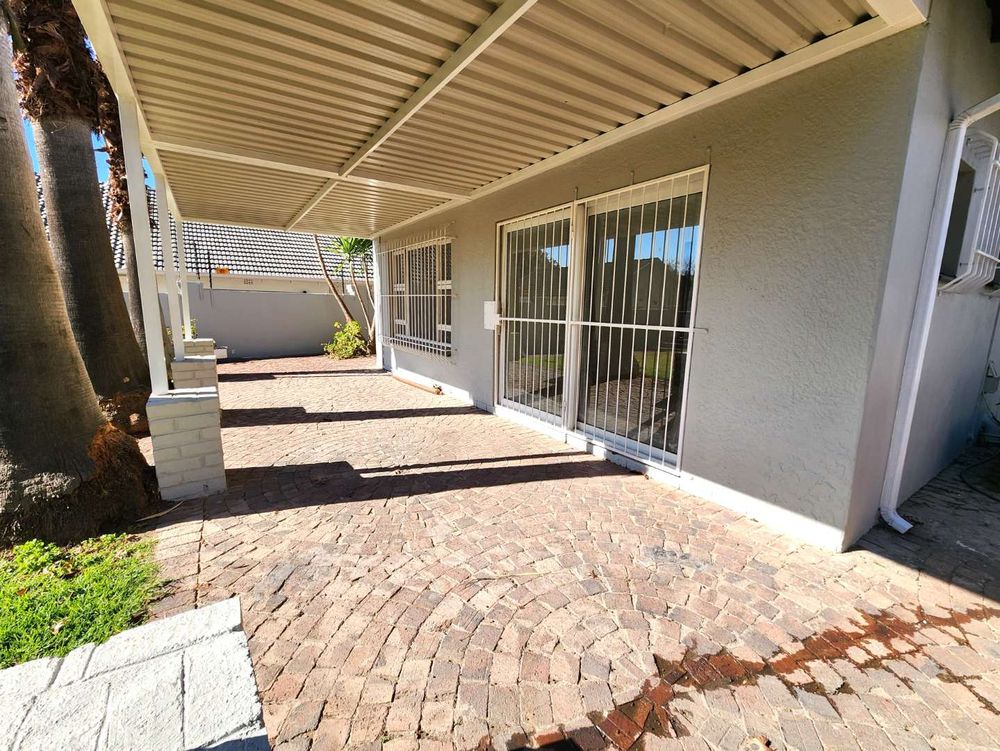 View of patio to sliding door entrance