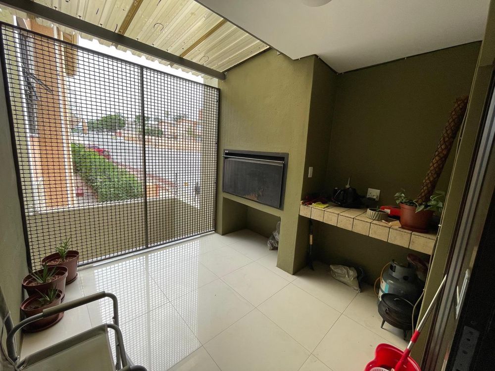 Barbeque area leading to lounge