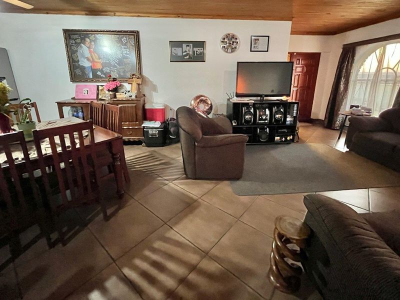 "Elegant Face Brick Home with Modern Security and Ample Parking! - Photo 3