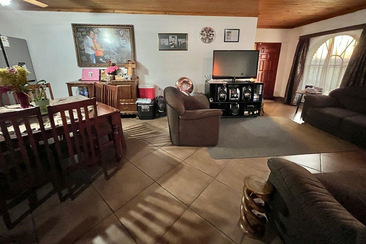 "Elegant Face Brick Home with Modern Security and Ample Parking! - Photo 3