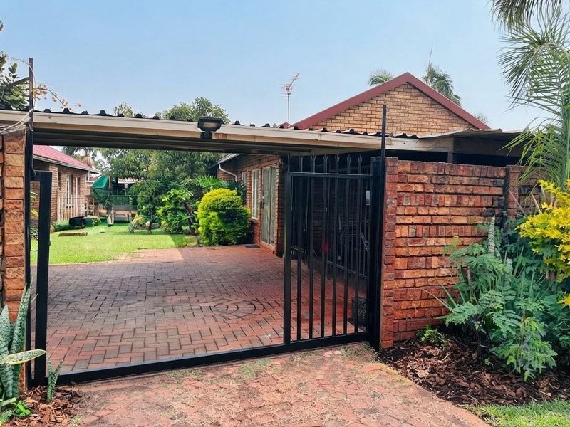 Exceptionally Secure Two-Bedroom Townhouse with Private Garden Retreat - Photo 1