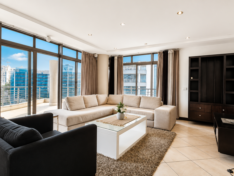 Spacious living room featuring large floor-to-ceiling sliding glass doors, tiled flooring, recessed lighting, and a built-in shelving unit with an urban city view.