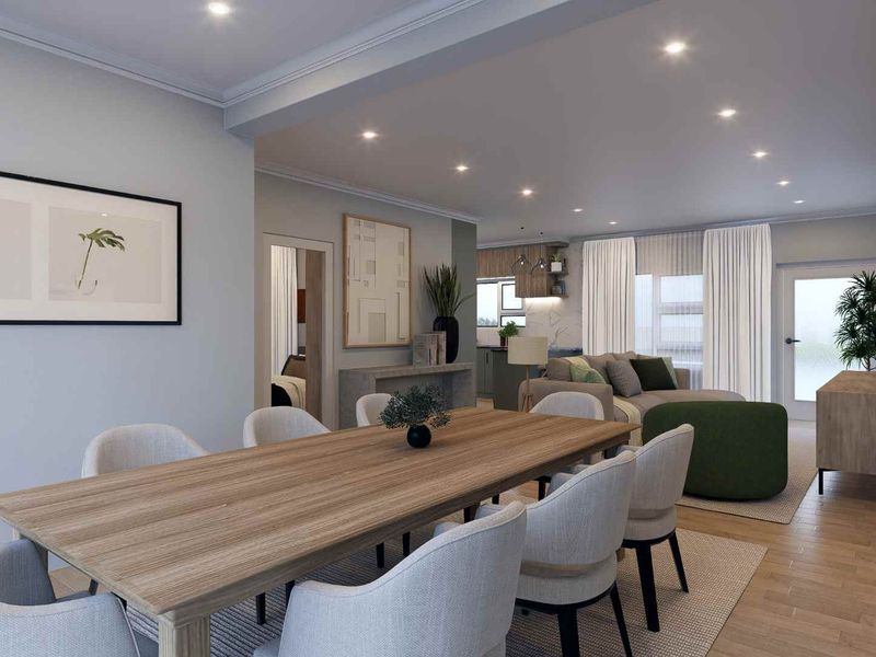 A modern open-plan living and dining area featuring recessed lighting, crown molding, and high-quality hardwood flooring, seamlessly connecting to a contemporary kitchen space.