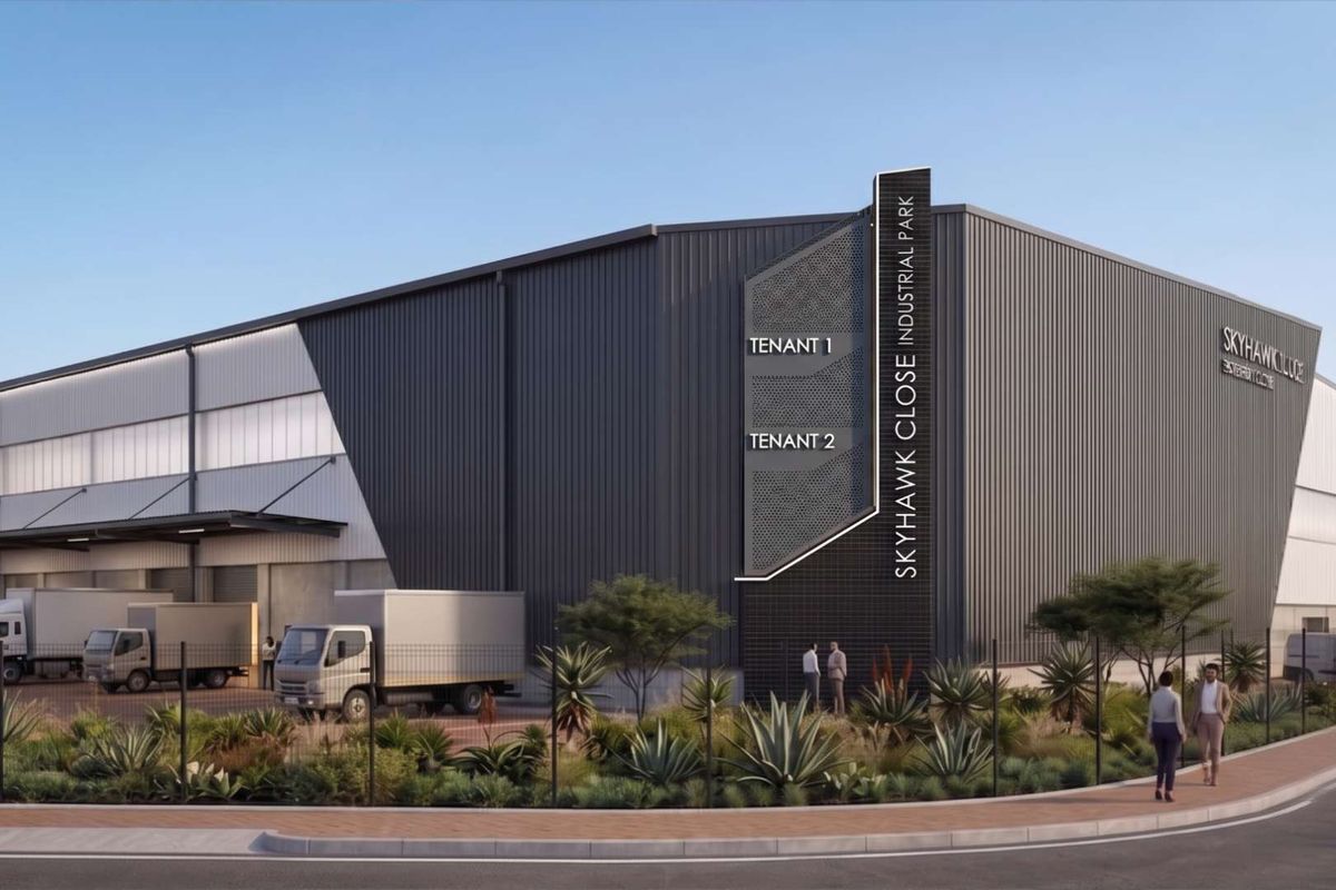 Modern industrial warehouse facility featuring corrugated metal cladding, dedicated loading bays, and professional signage within Skyhawk Close Industrial Park.
