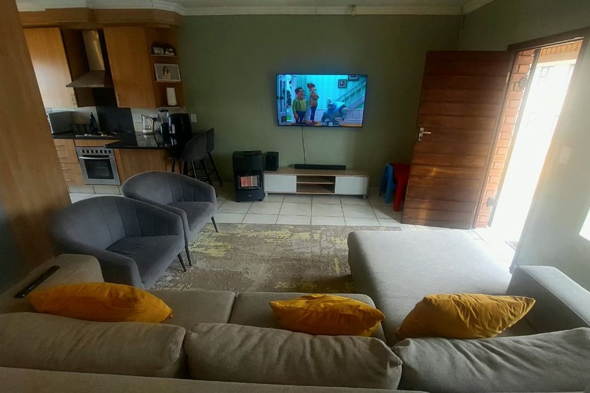 Modern 2-Bedroom Home with Open-Plan Living & Balcony - Photo 2