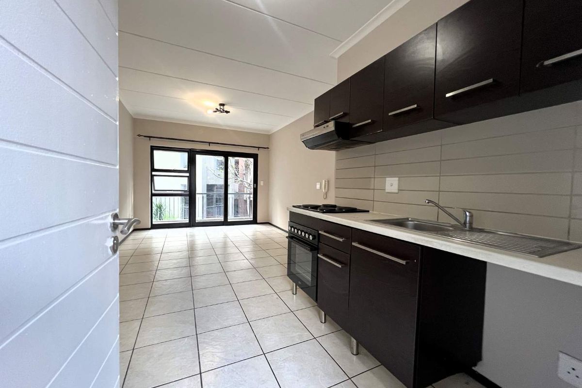 Live Securely in Style: 2-Bedroom Middle-Floor Gem! - Photo 3