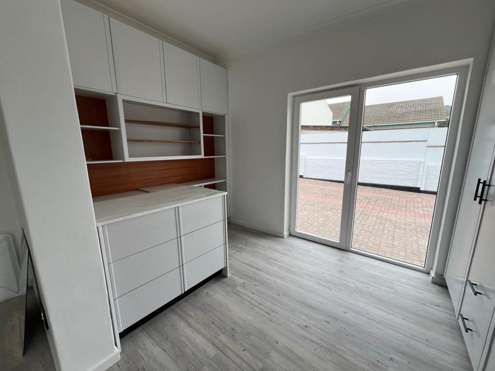 Main bedroom with walk-in closet and sliding door