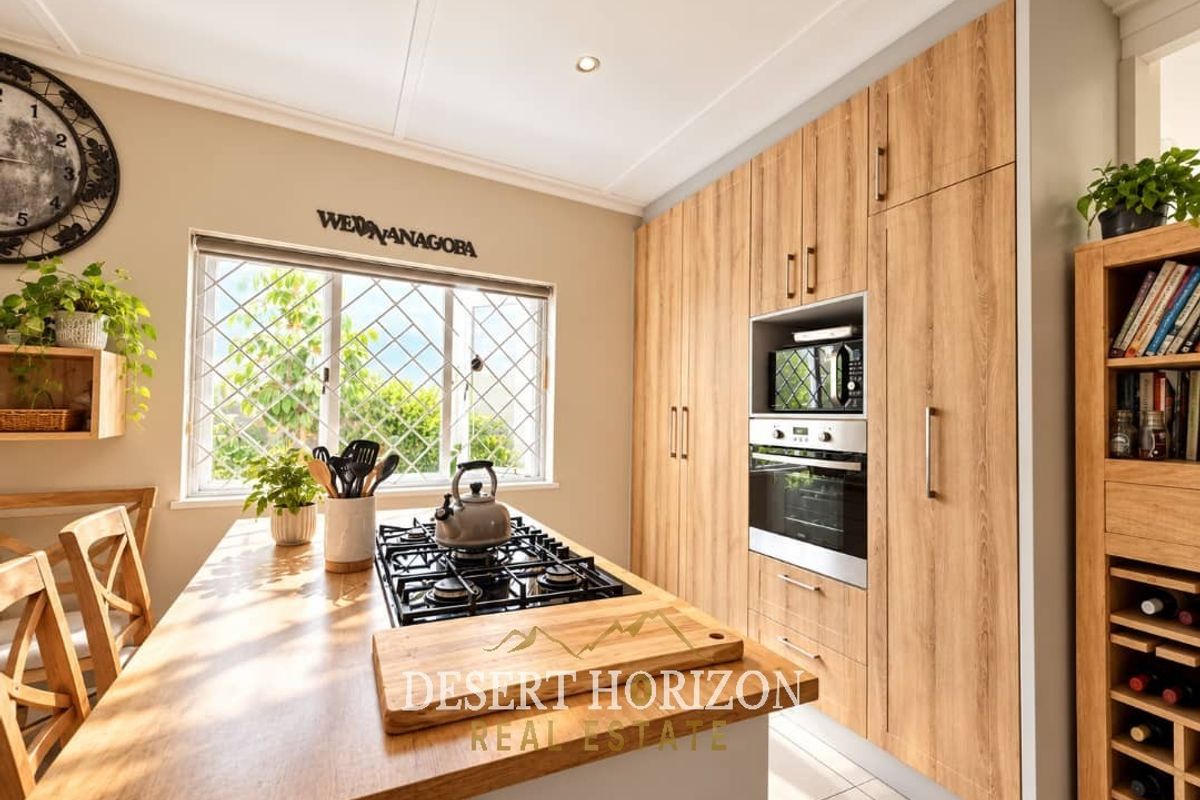 Modern kitchen featuring wood-look cabinetry, a central island with a built-in gas hob, and integrated oven and microwave appliances.