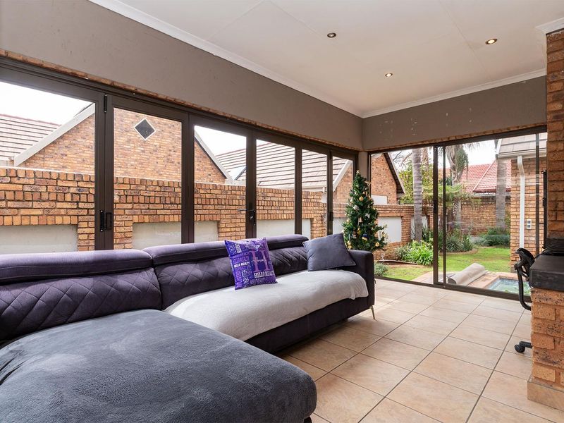 Lovely 3-bedroom facebrick home with a pool situated in a secure estate in Glen Marais - Photo 5