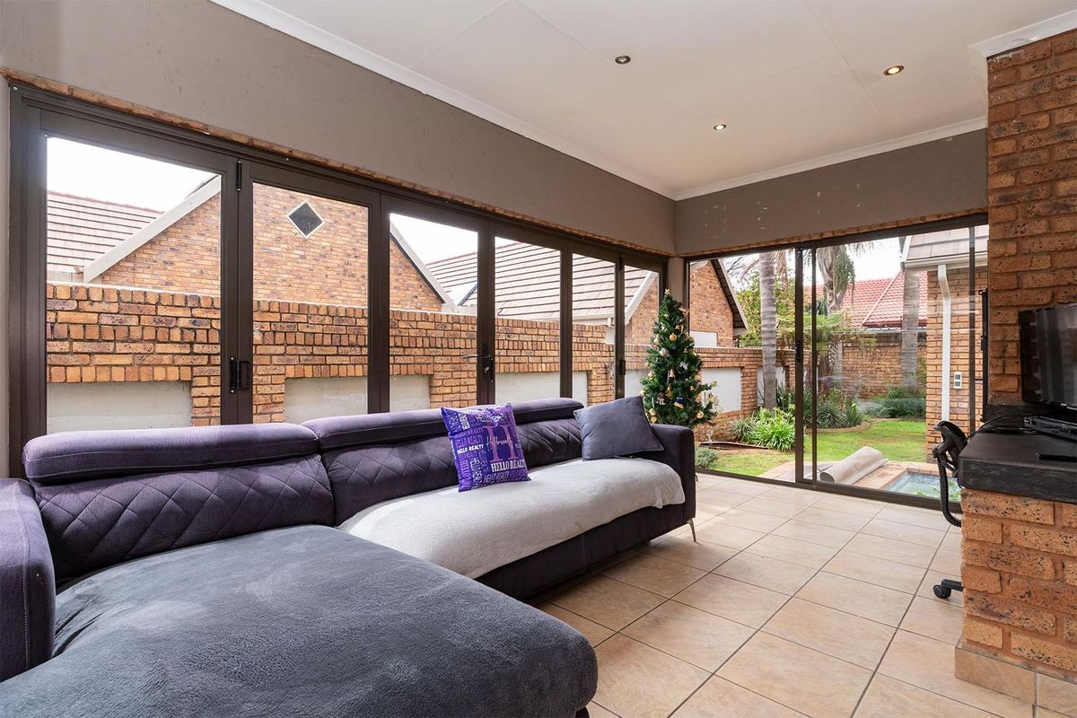 Lovely 3-bedroom facebrick home with a pool situated in a secure estate in Glen Marais - Photo 5