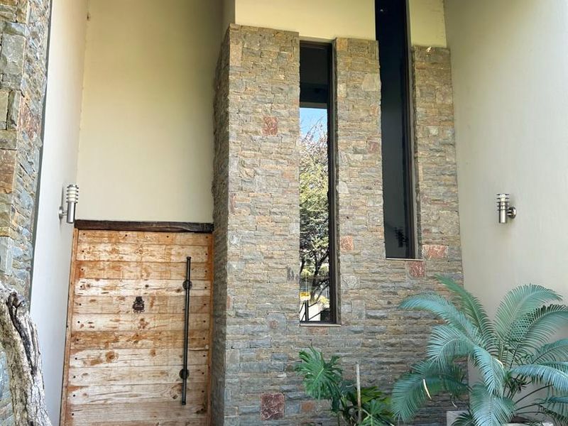 Modern 5-bedroom double story property with serene views. - Photo 4