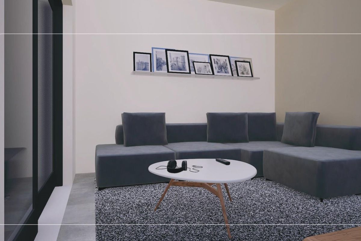 A modern living room featuring sleek sliding glass doors and neutral wall finishes, providing a clean and contemporary space.