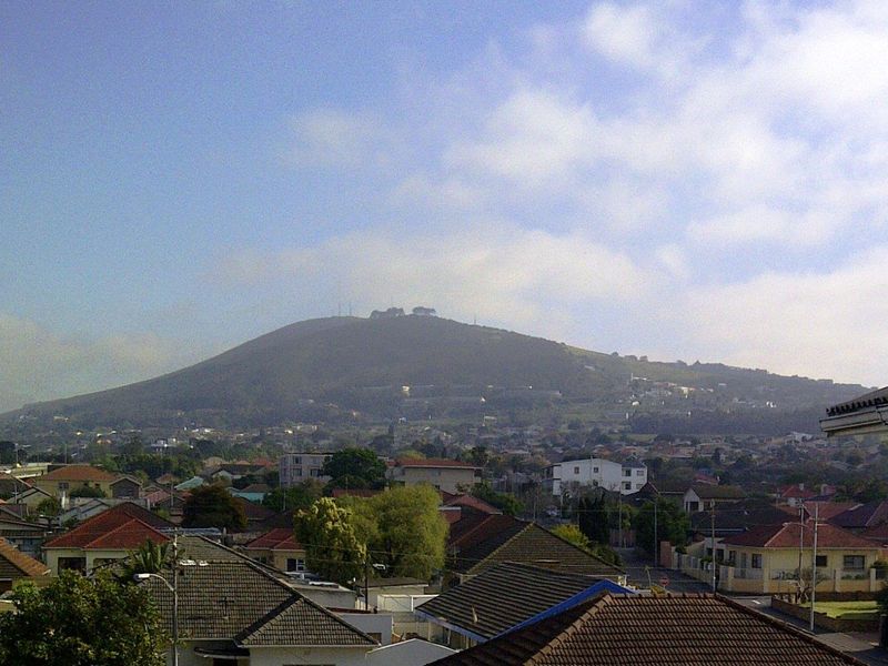 Elevated scenic view overlooking the surrounding residential neighbourhood and a prominent mountain in the distance.