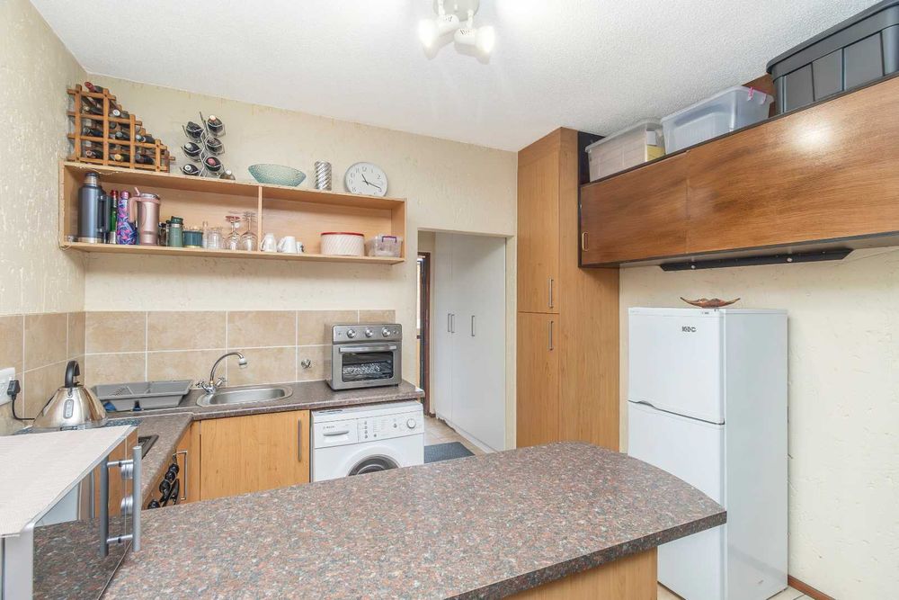 Extra cupboard space and space for any size fridge!