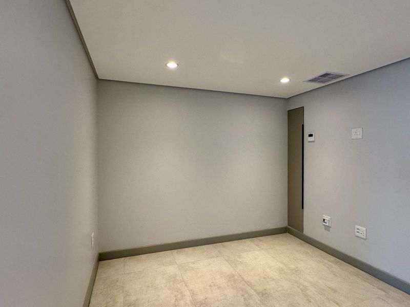 This is a premium, move-in-ready coastal apartment that combines luxury, security, and modern convenience in a sleek, never-before-lived-in space. - Photo 8