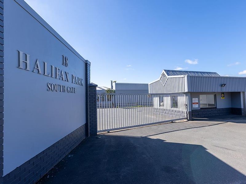 Main entrance gate and security access point for Halifax Park South Gate industrial facility, featuring secure perimeter fencing and paved driveway.