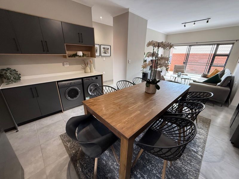 Sophisticated 3-Bedroom Simplex with Double Garage and Private Garden Sanctuary - Photo 7