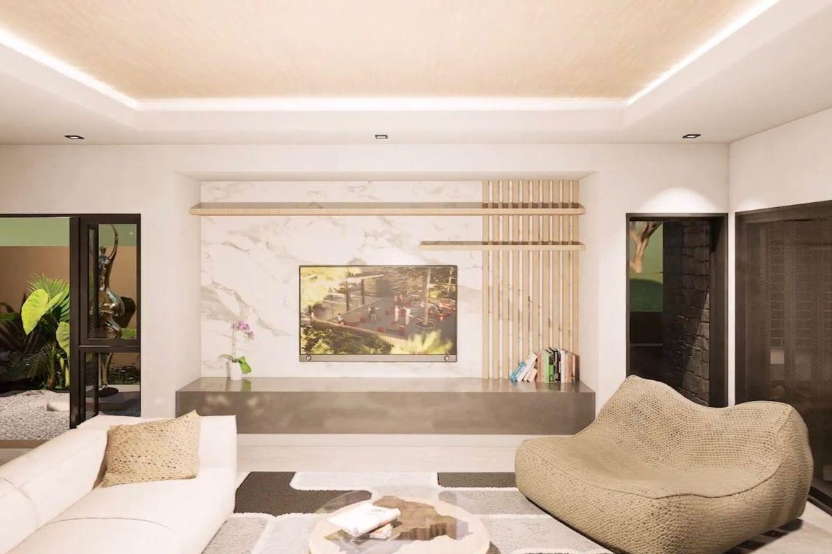 Modern living room featuring a custom marble-clad media wall with integrated shelving, recessed tray ceiling lighting, and large glass doors opening to a private courtyard.
