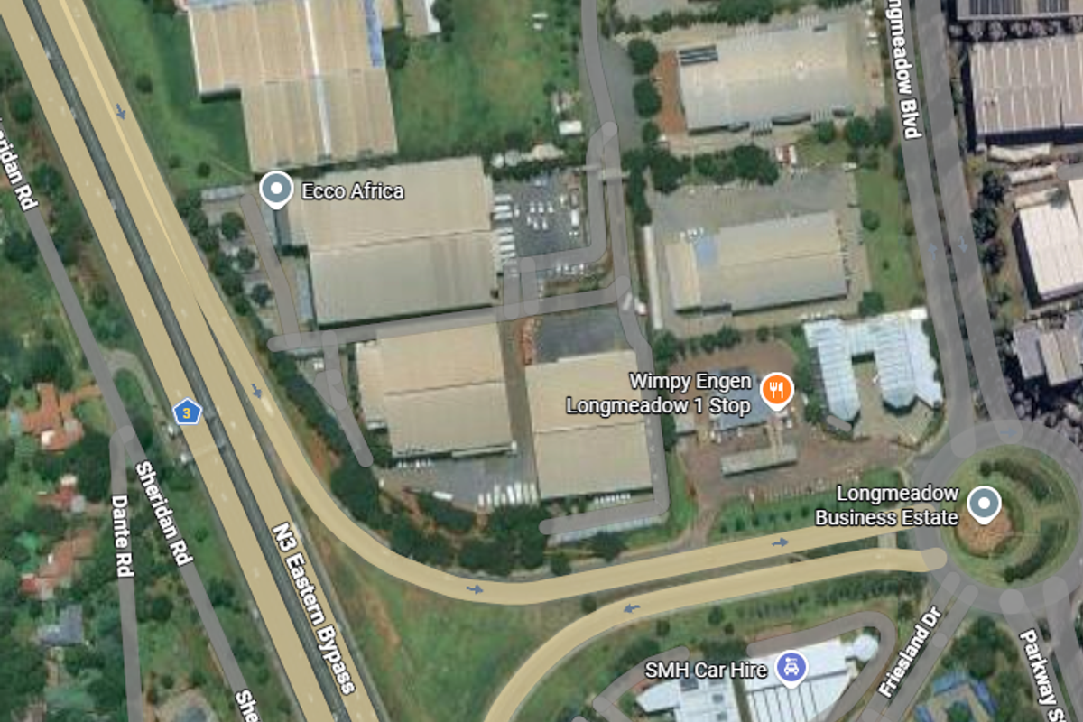 Aerial view of an industrial business estate featuring multiple warehouse facilities, paved access roads, and direct proximity to the N3 Eastern Bypass highway.