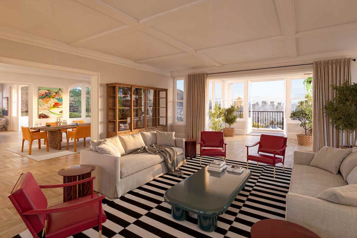 Spacious living room featuring elegant coffered ceilings, classic parquet flooring, and seamless access to a balcony with scenic city views.