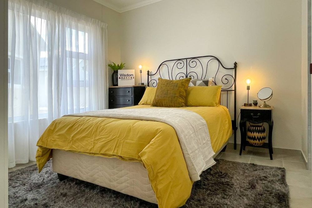 Main bedroom with built-in cupboards and ensuite bathroom.
