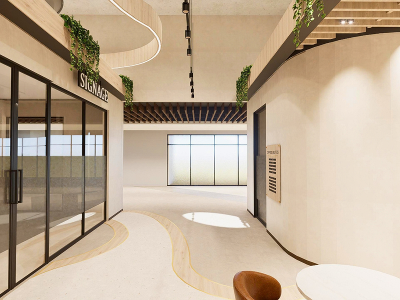 Modern office interior featuring glass partitions, curved architectural walls, and high-end finishes with integrated lighting and timber ceiling details.