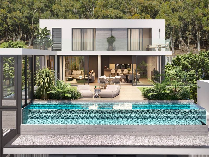 Modern rear elevation featuring a contemporary swimming pool, spacious tiled patio, and large sliding glass doors opening to an open-plan living area.